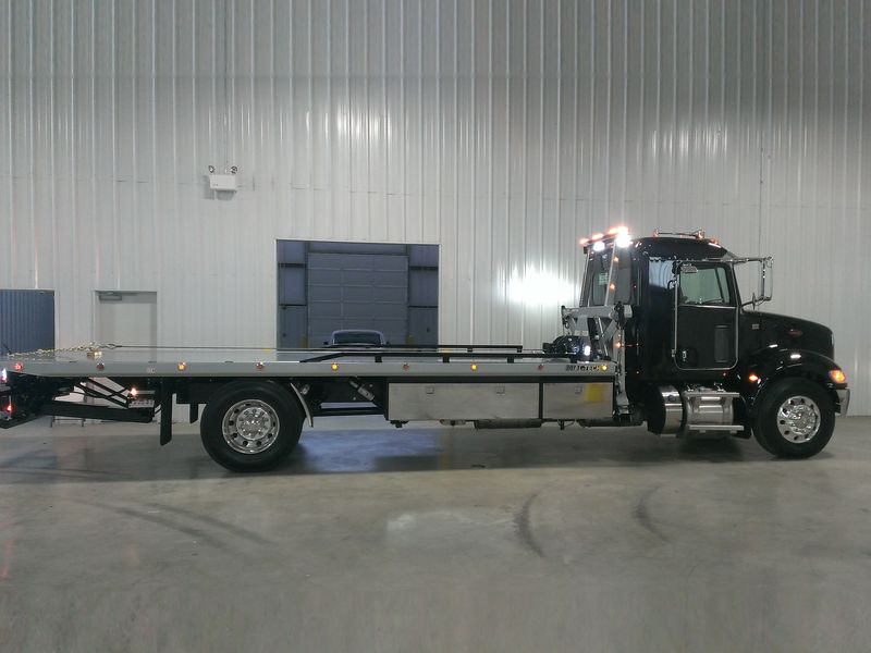 16 Series Gen II rollback on a black Peterbilt